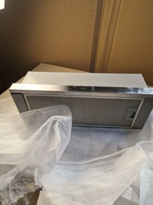 a microwave that is sitting on a table in a box