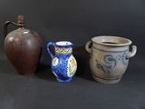 three different types of vases sitting on a table