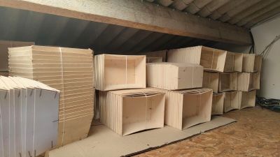 many cardboard boxes stacked on top of each other in a room