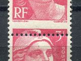 a pair of stamps with a woman ' s face on them