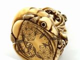 an image of a ring with a carved elephant