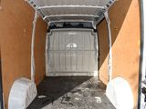 a white van that is parked inside of a building