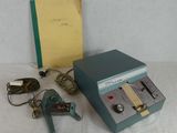 an image of a small machine that is sitting on top of a table