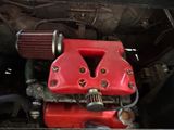 a close up of a red engine in a truck