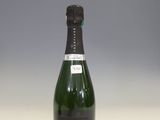 a bottle of champagne sitting on a table