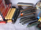 many different types of toy trains on the table