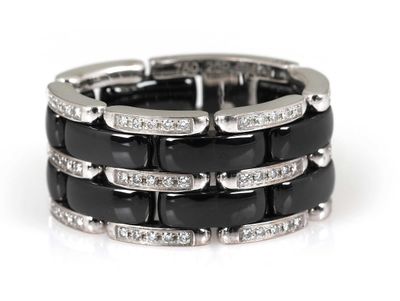 an image of a black and white diamond ring on a white background