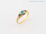 a close up of a gold ring with a turquoise stone