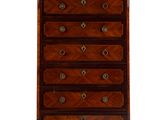 an antique chest of drawers with marble top