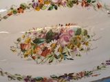 a large white plate with a floral design on it