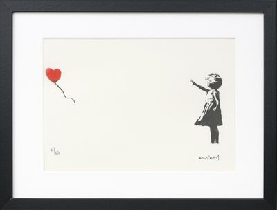 a framed picture of a girl with a red balloon in the shape of a heart