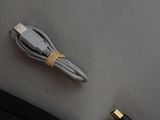 a usb cable connected to a computer mouse on a desk