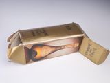 a cardboard box with a bottle of wine inside of it