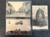 three old postcards of a man and a plane on a city street