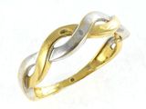 an image of a gold and silver ring on a white surface