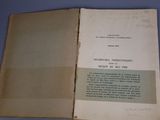 an open book with a handwritten title on it sitting on a table