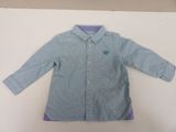 blue and white shirt with purple trim on a white surface