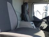 a seat in the back of a truck with a steering wheel