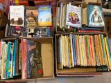 many books that are sitting in a box on the floor