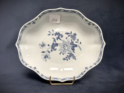 an image of a blue and white plate with flowers on it
