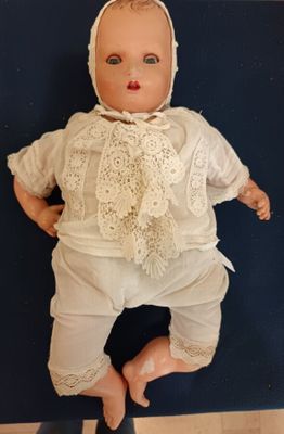 MAC, poupon tête en celluloïde, bouche ouverte sur dents, ye…