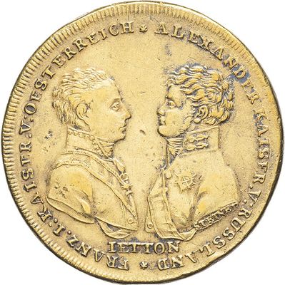 a close up of a coin with a man and a woman on it