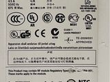 a close up of a white box containing an electronic device