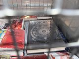a cage filled with books and magazines for sale