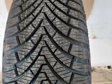 a close up of a tire on a cardboard box