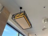 a light that is hanging from the ceiling in a restaurant