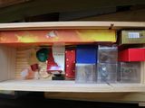 a wooden box with a bunch of items inside of it