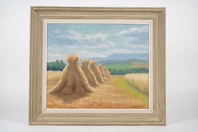 a painting of hay stacks in a field with mountains in the background