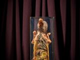 an image of a statue of a man in a glass case