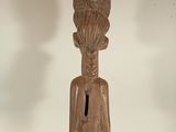 statue of a man with a keyhole in his mouth
