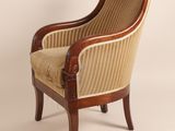 an image of a chair with a striped upholstered back and arms