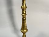 pair of antique brass candlesticks on a white background