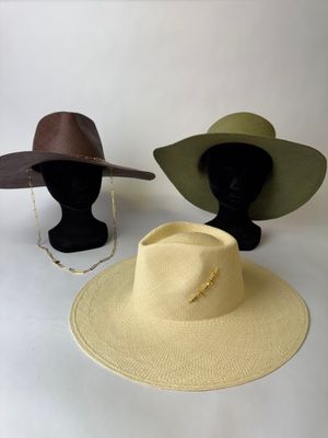 two hats on a mannequin head and a hat on a mannequin head