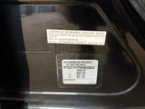 a close up of a parking meter with a sticker on it