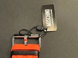 an orange watch strap with a black buckle on it