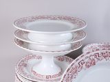 many plates stacked on top of each other on a table
