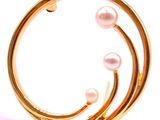 gold plated ring with pearl beads on a white background
