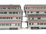 three model trains are stacked on top of each other on a white surface