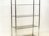 a chrome and glass shelf with four shelves