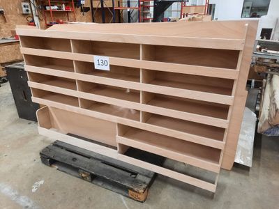 a wooden shelf that has a number of shelves on it