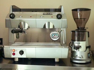 a coffee machine and a grinder on a counter