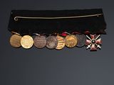 an image of a belt with a lot of medals on it