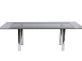 une table en verre avec des pieds chromés et un plateau en verre