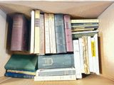 a box full of books sitting on top of a table