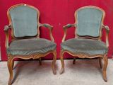 pair of antique chairs with upholstered upholstered arms