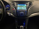 the dashboard of a car with a gps device in the center of it